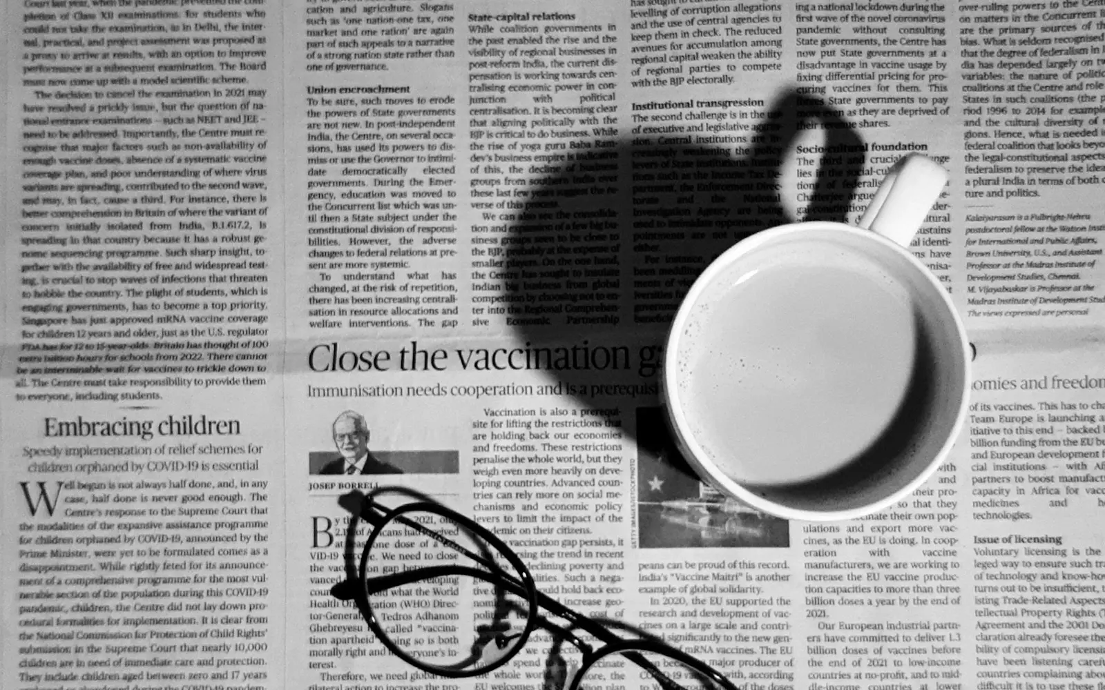 Glasses resting on a newspaper